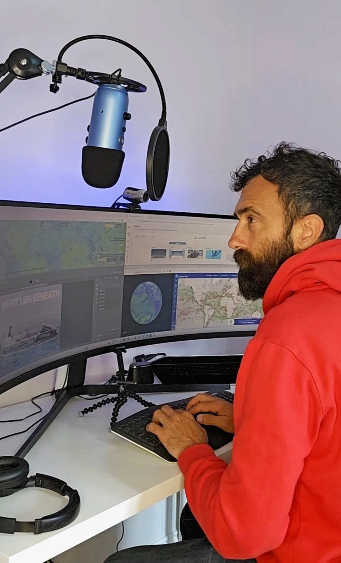 Barry Hayes of Shark Bait Socials sat at his desk working on Social Media posts